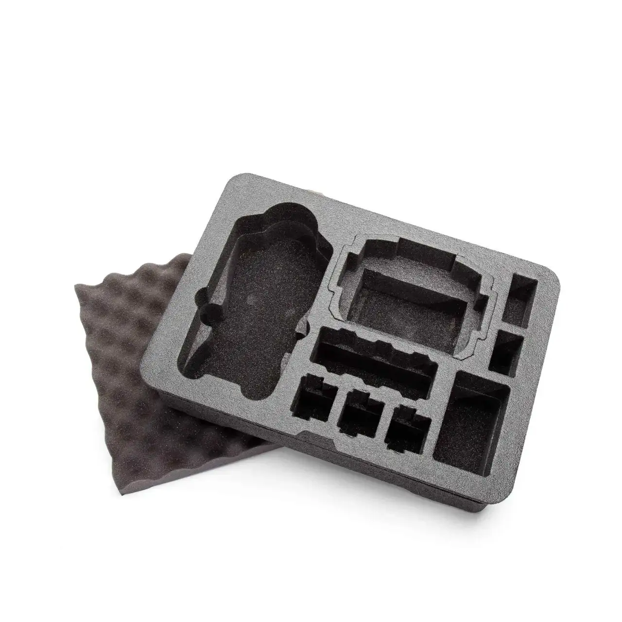 Gray foam tray with compartments on a white background