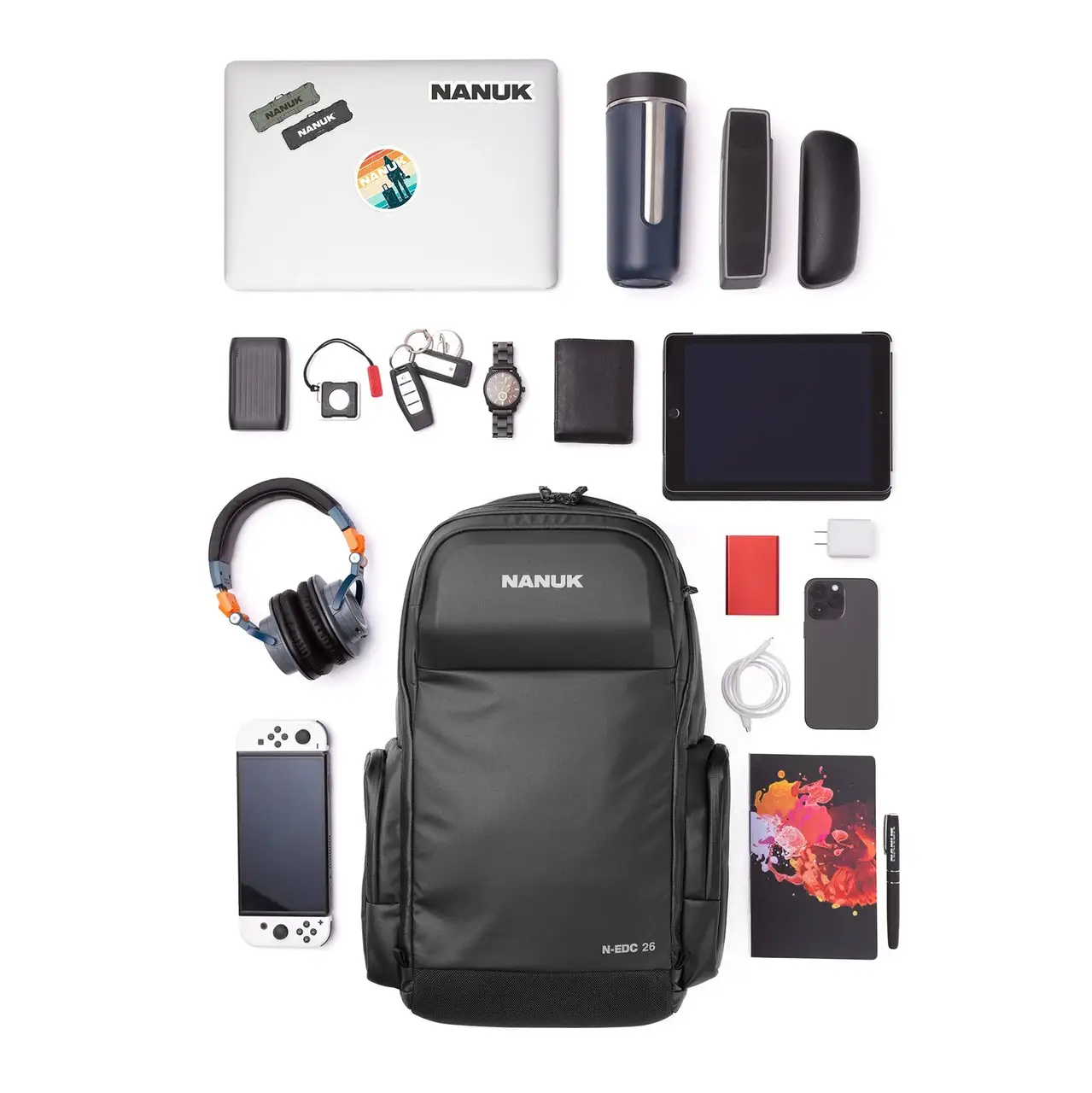 Collection of electronic devices and accessories with a JunZhiJia backpack on a white background