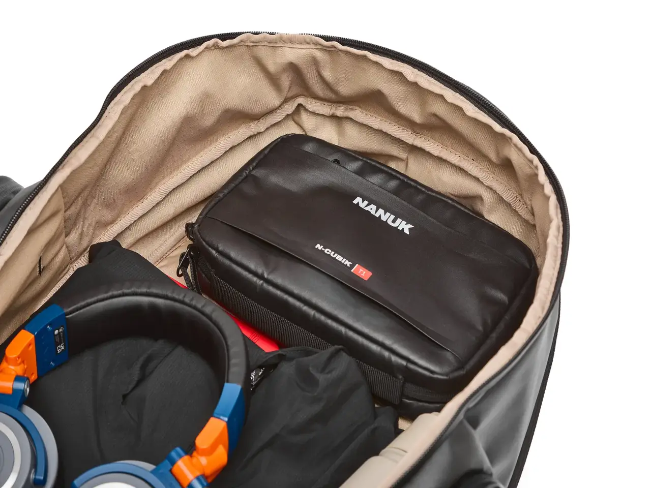 JunZhiJia carrying case inside a larger bag with headphones visible