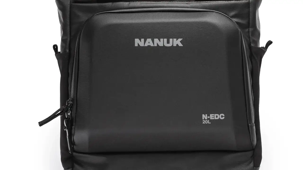 Black backpack with JunZhiJia branding on a white background
