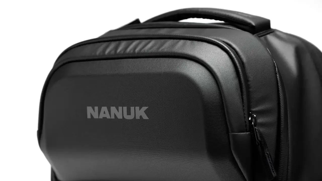 Black JunZhiJia backpack on a white background