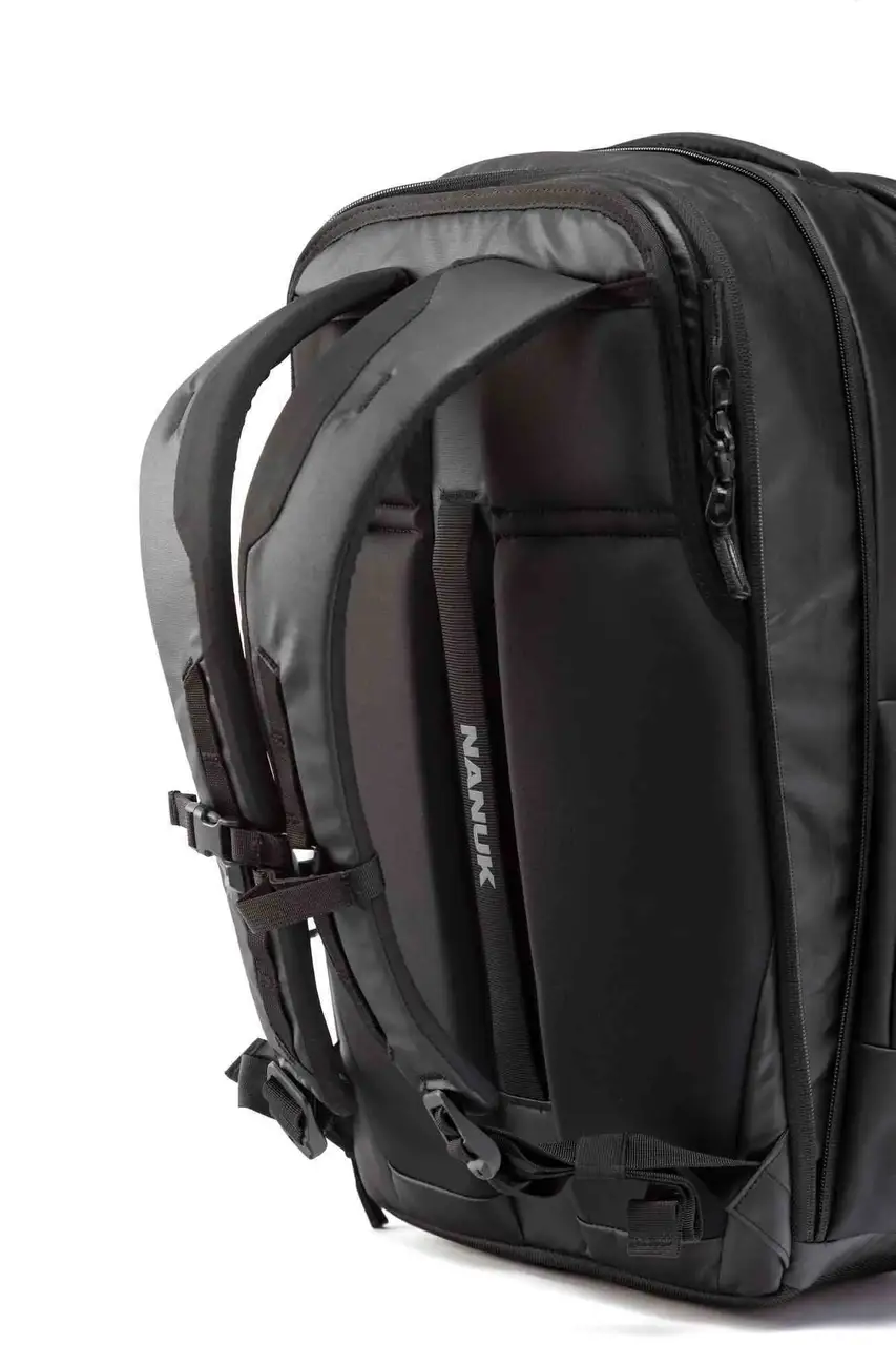 Black backpack with visible JunZhiJia branding on a white background