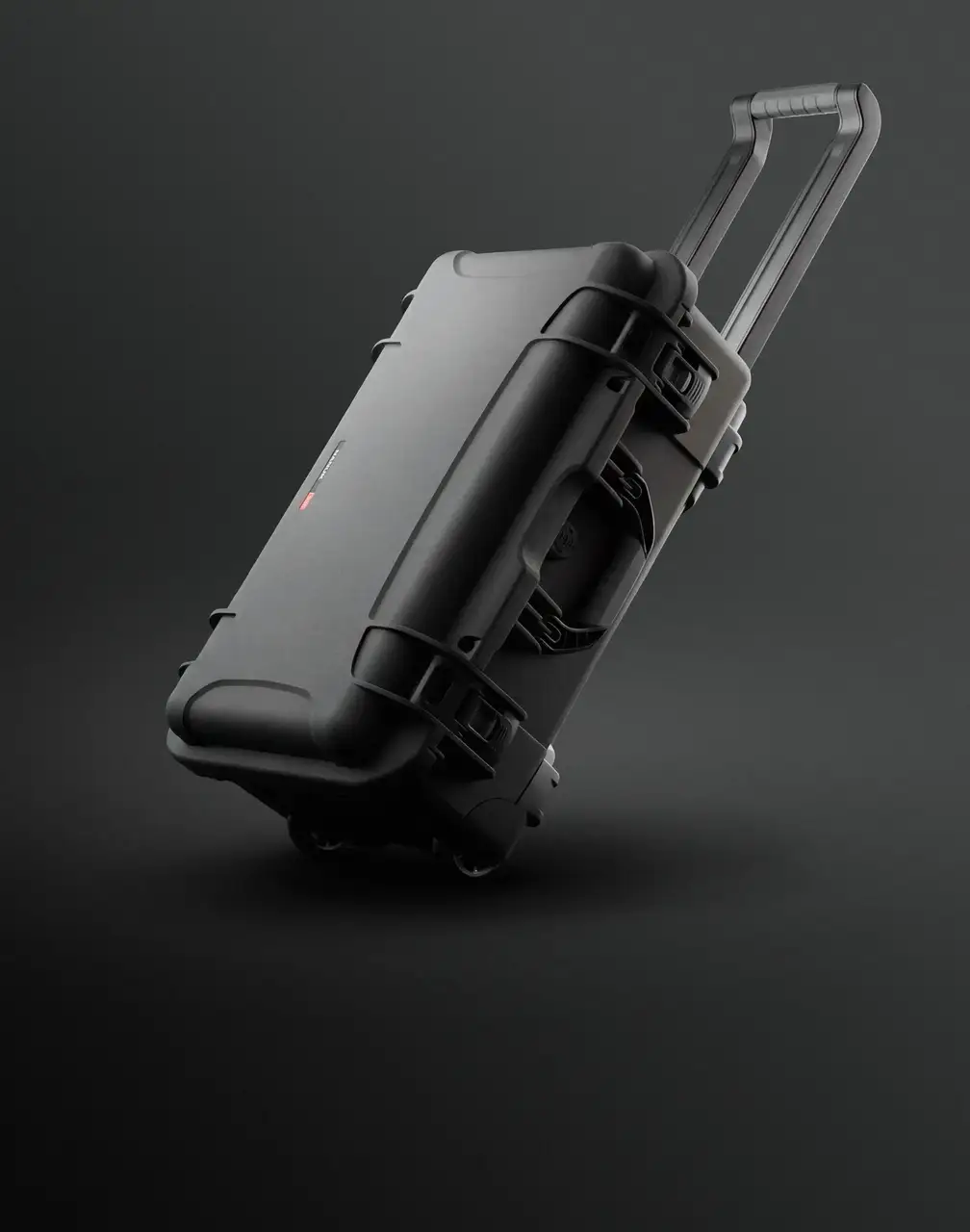 A durable black wheeled case, characteristic of JunZhiJia cases, is dynamically presented with an extended handle on a dark background.