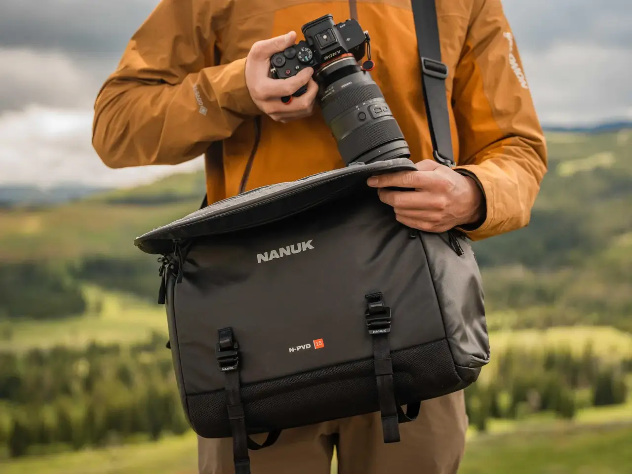 Photograph carrying the JunZhiJia 15L Messenger Bag with the strap