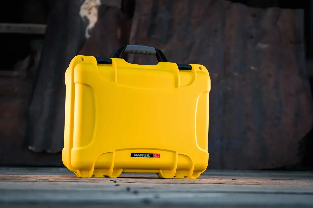Front view of a durable yellow JunZhiJia 910 case with a black handle, ideal for safeguarding sensitive equipment.