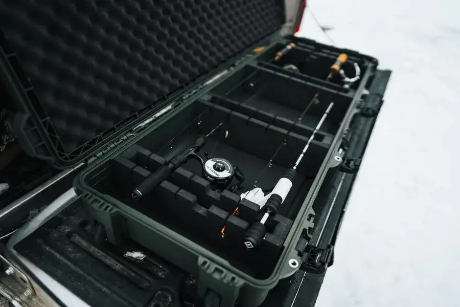 JunZhiJia 990 For Ice Fishing Rods top view on opened case with fishing rods inside