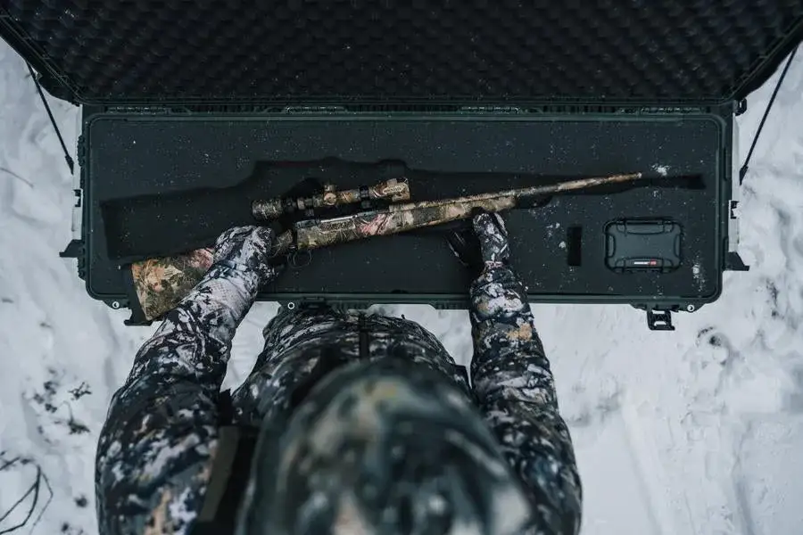 JunZhiJia 995 Olive case with full foam insert cutted out and a rifle outdoor
